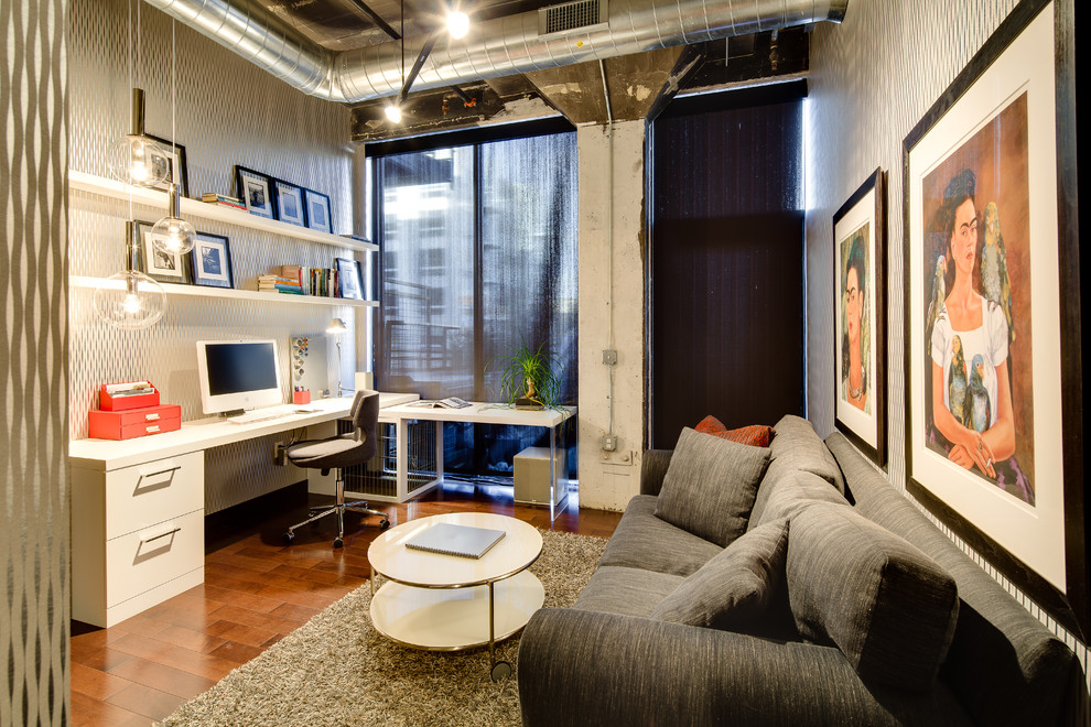 Photo of an urban home office in Minneapolis with dark hardwood flooring and a built-in desk.