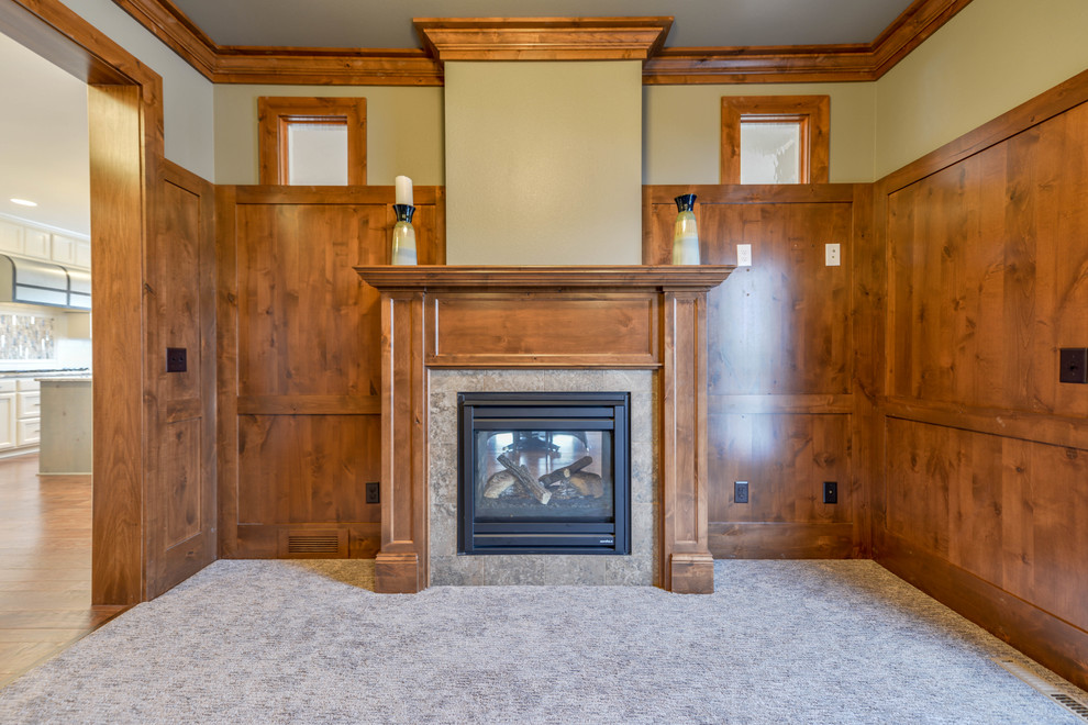Inspiration for a small timeless carpeted study room remodel in Minneapolis with gray walls, a standard fireplace and a stone fireplace