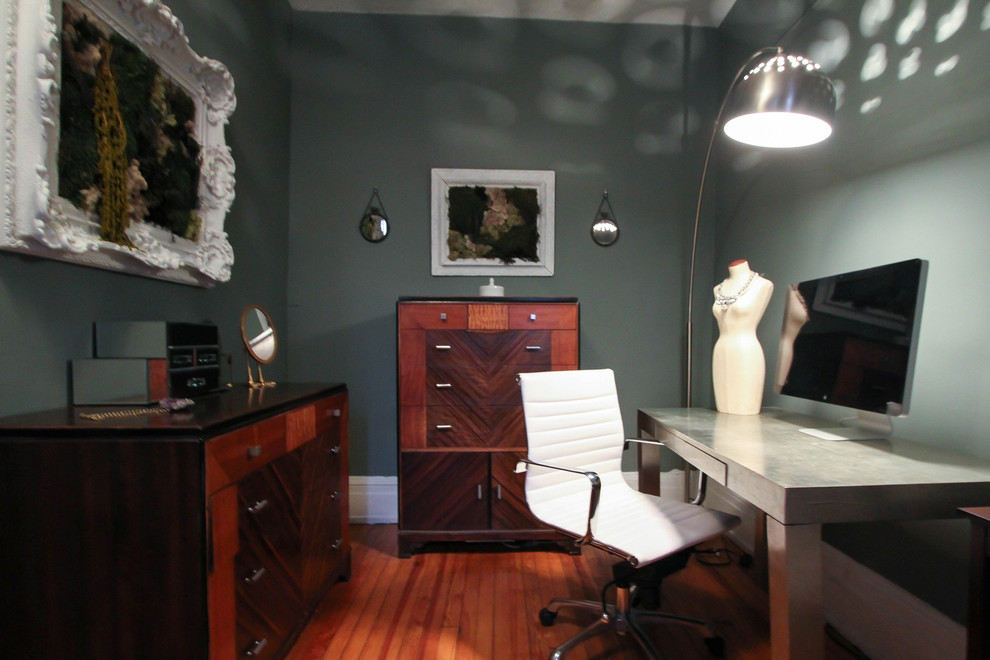 Inspiration for a small contemporary freestanding desk medium tone wood floor study room remodel in New York with green walls