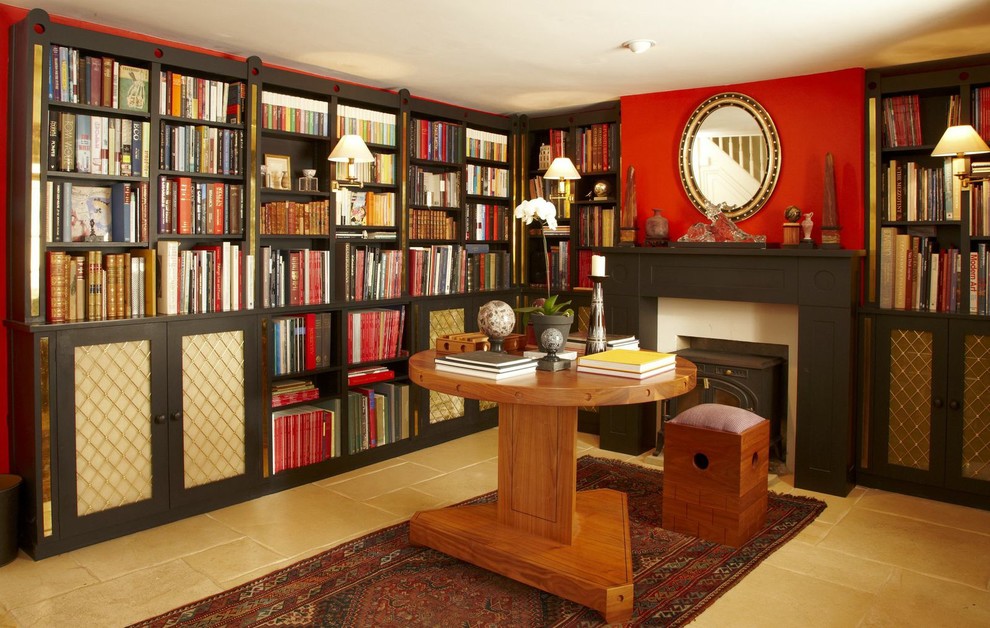 Design ideas for a modern home office in London with red walls and a freestanding desk.