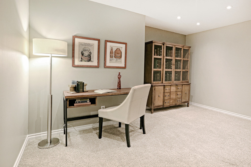 Example of a mid-sized eclectic freestanding desk carpeted and beige floor study room design in Calgary with gray walls and no fireplace
