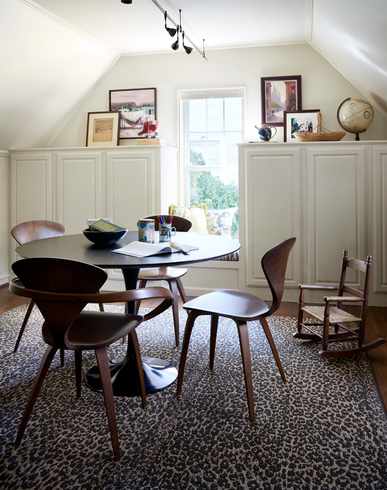 Eclectic freestanding desk medium tone wood floor and brown floor study room photo in Dallas with beige walls
