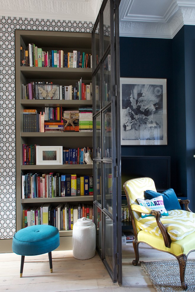 Design ideas for a medium sized eclectic home office in London with blue walls and light hardwood flooring.