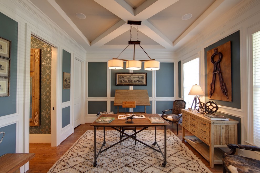 Example of an eclectic freestanding desk dark wood floor study room design in Charlotte with blue walls