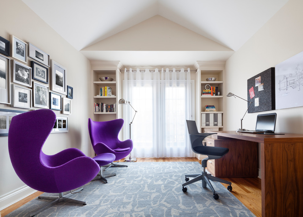 Mid-sized eclectic freestanding desk medium tone wood floor study room photo in Toronto with beige walls