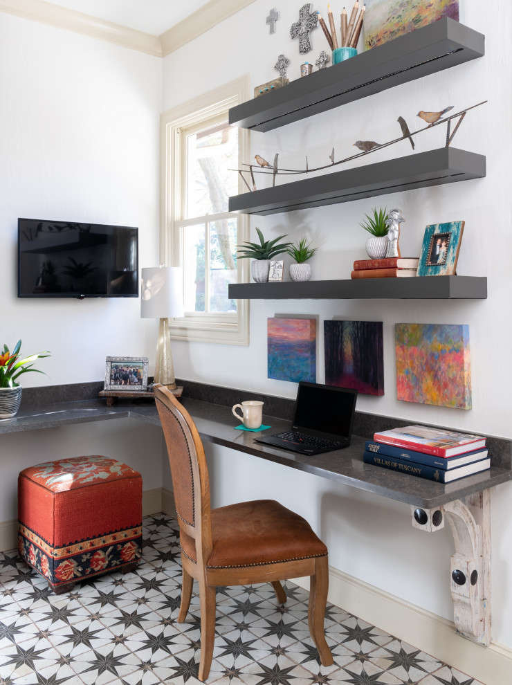 Example of a small eclectic built-in desk ceramic tile and multicolored floor study room design in Dallas with white walls