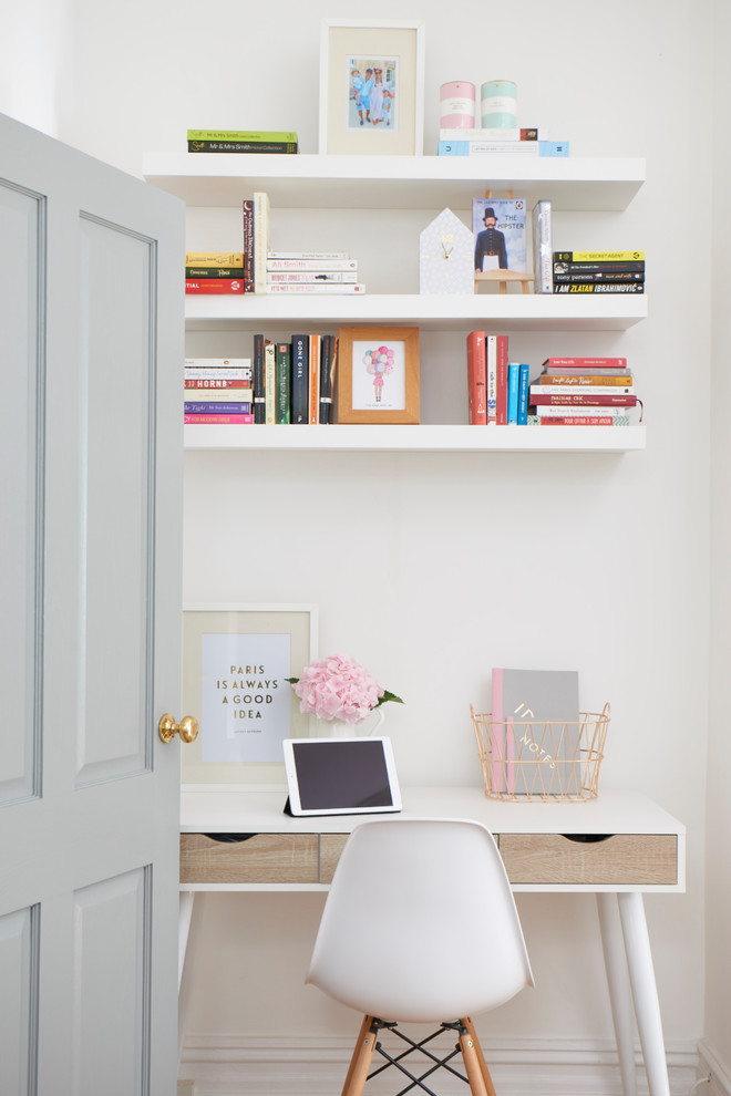 Mid-sized danish freestanding desk home office photo in London with white walls