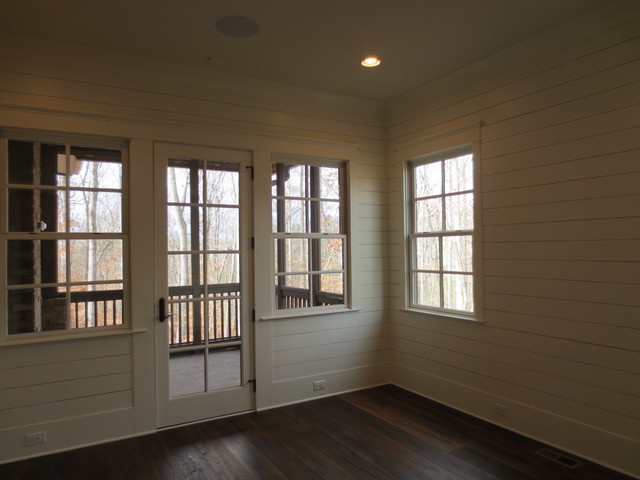 Photo of a medium sized bohemian study in Atlanta with white walls, medium hardwood flooring and a freestanding desk.