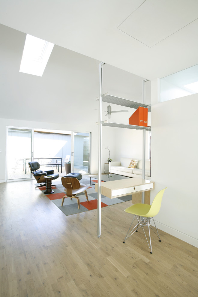 Example of a danish home office design in Los Angeles with white walls