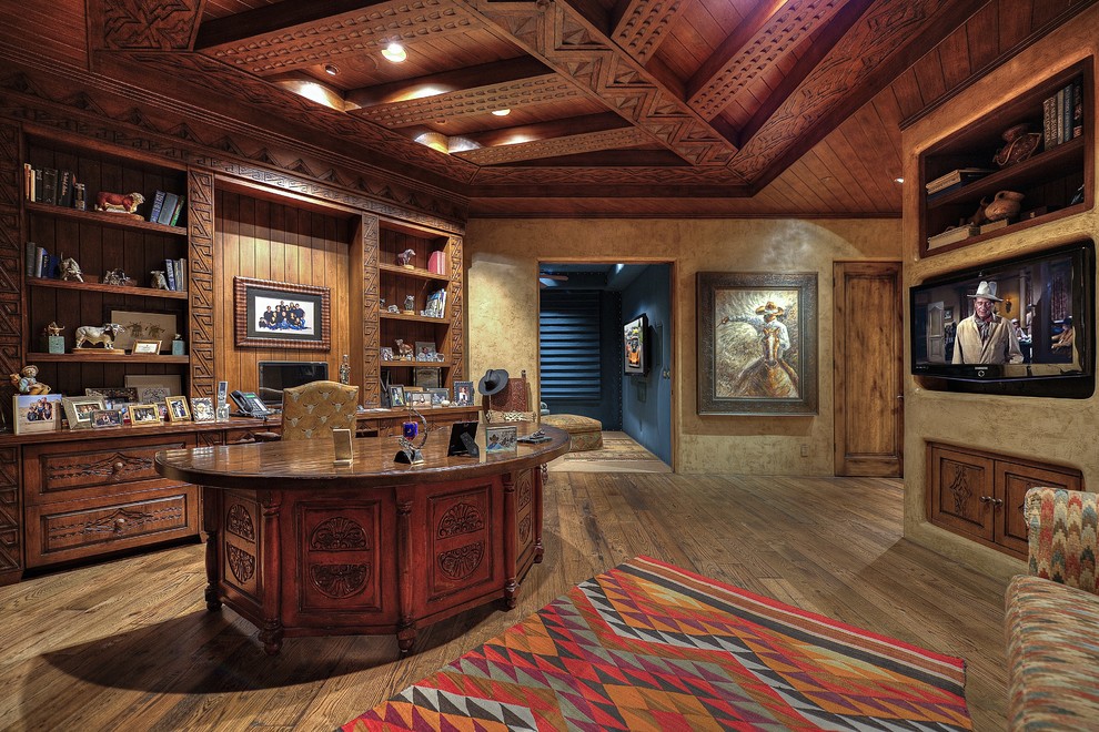 Example of a southwest home office design in Phoenix