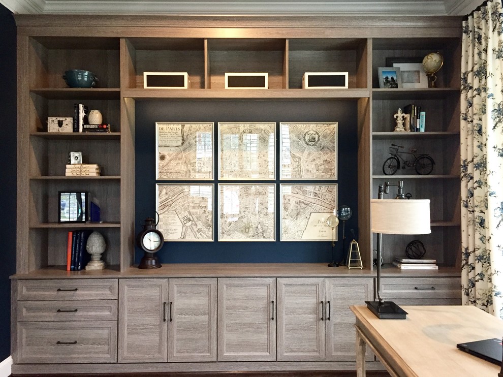 Large transitional freestanding desk dark wood floor study room photo in DC Metro with blue walls and no fireplace