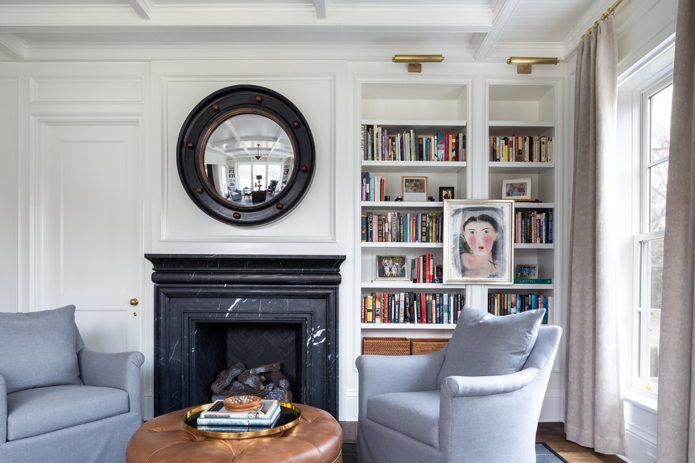 This is an example of a medium sized classic home office in Chicago with a reading nook, white walls, dark hardwood flooring, a standard fireplace, a stone fireplace surround and a freestanding desk.