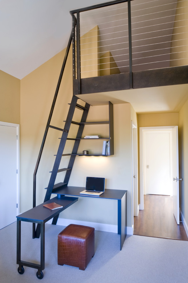 Example of a trendy freestanding desk carpeted home office design in San Francisco with beige walls