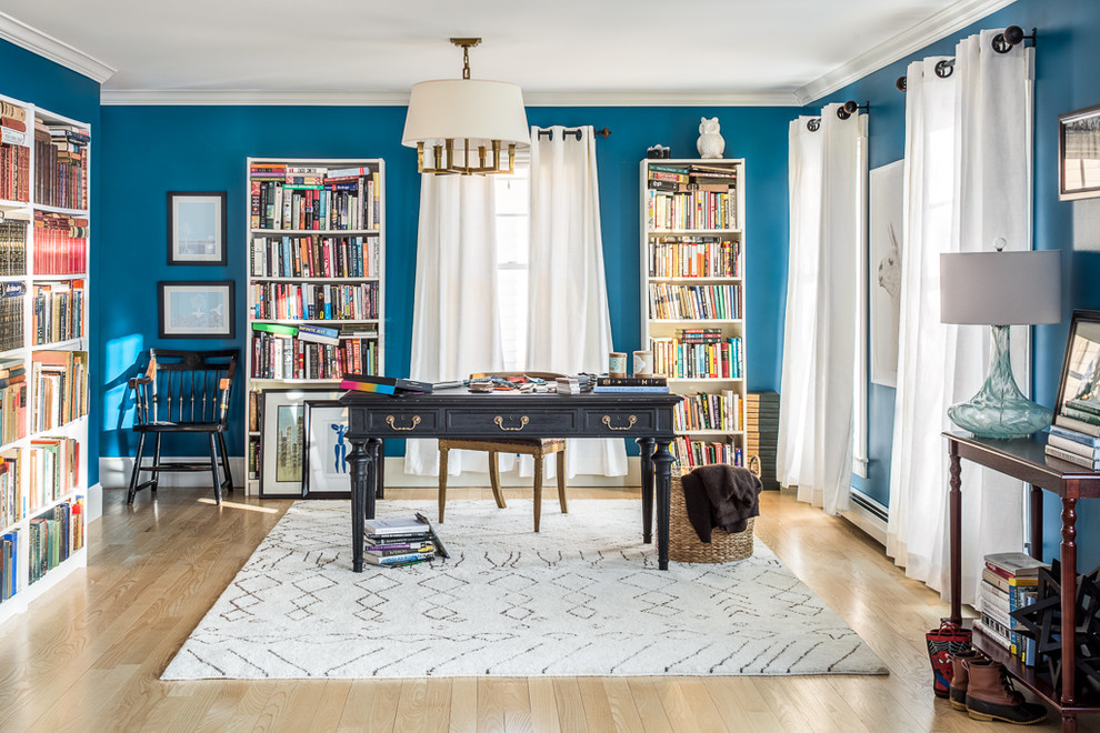 Example of a transitional freestanding desk light wood floor study room design in Portland Maine with blue walls