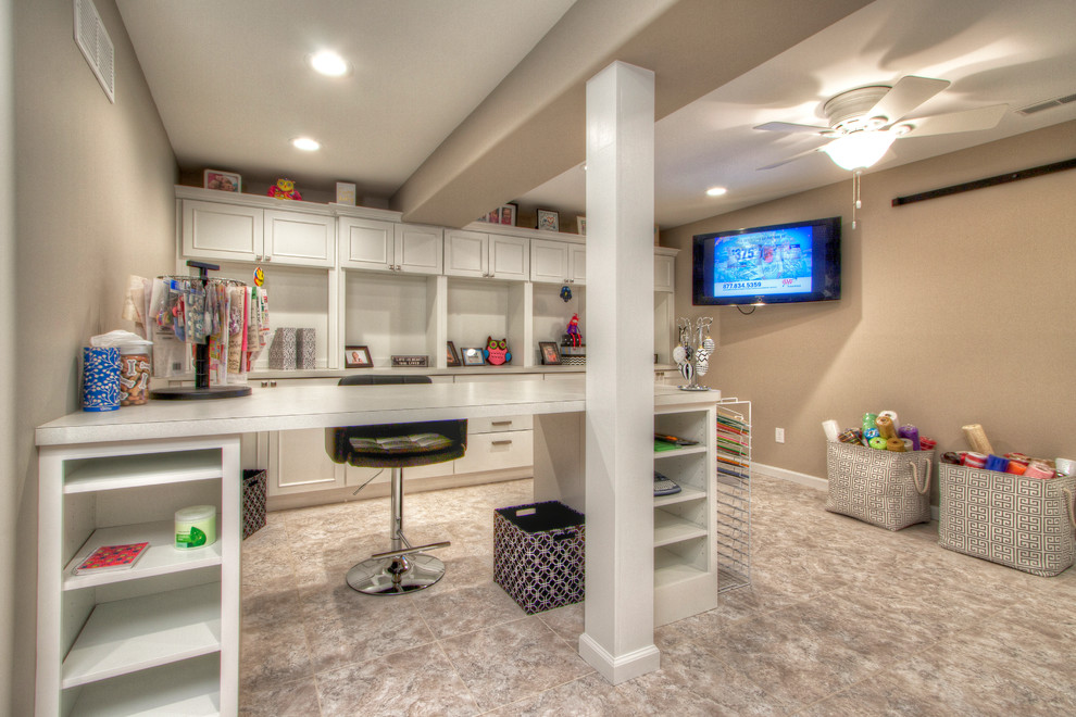 Huge trendy vinyl floor home office photo in St Louis with beige walls