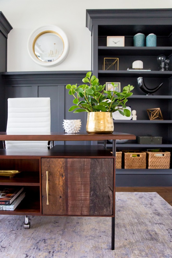 Example of a trendy freestanding desk medium tone wood floor home office design in Salt Lake City with white walls