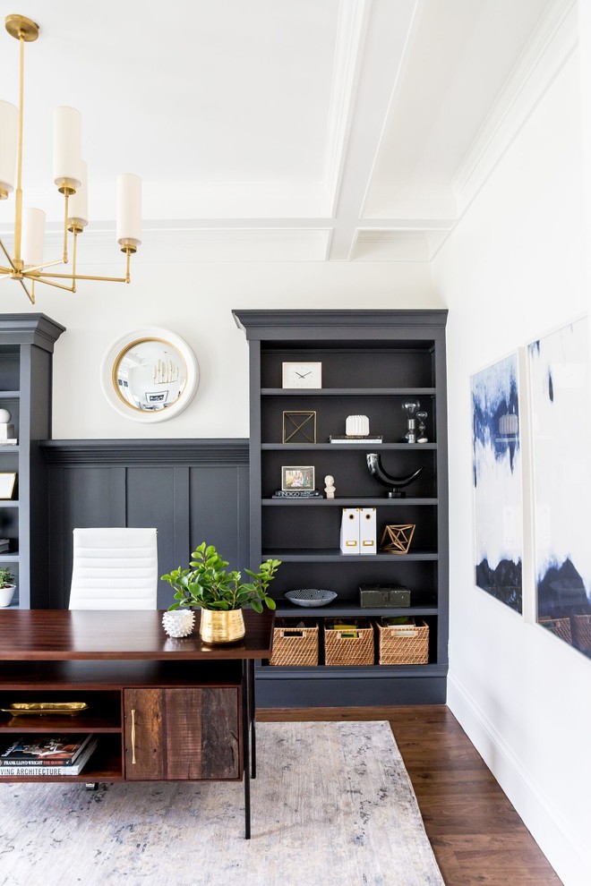 Trendy freestanding desk medium tone wood floor home office photo in Salt Lake City with white walls