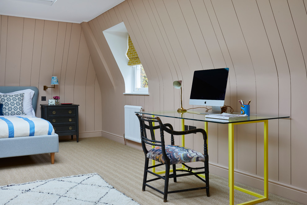Traditional study in London with beige walls, carpet, a freestanding desk and beige floors.