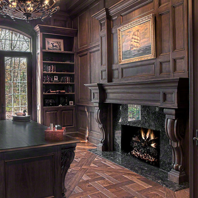 シカゴにあるラグジュアリーな広いラスティックスタイルのおしゃれな書斎 (茶色い壁、濃色無垢フローリング、標準型暖炉、石材の暖炉まわり、自立型机、茶色い床) の写真