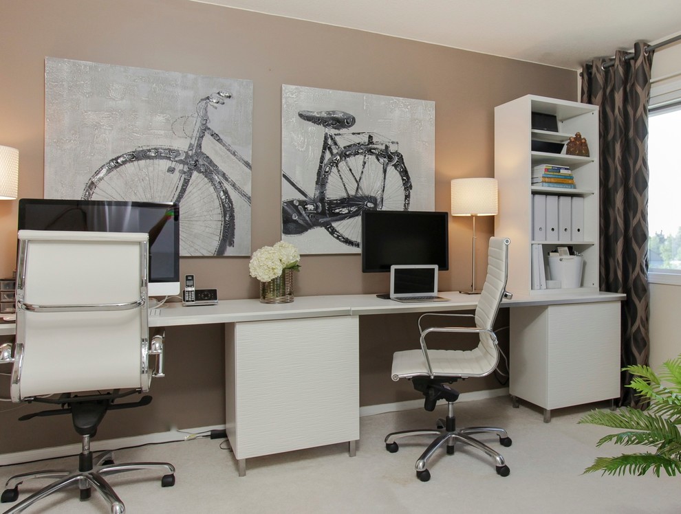 Medium sized contemporary home office in Edmonton with no fireplace and a freestanding desk.
