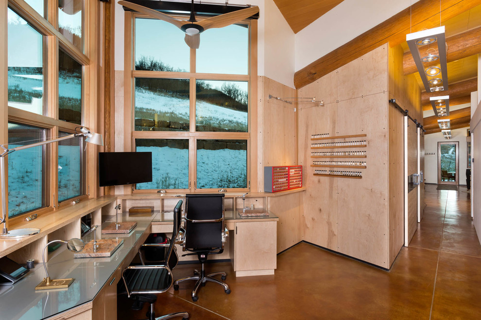 Mountain style built-in desk study room photo in Denver