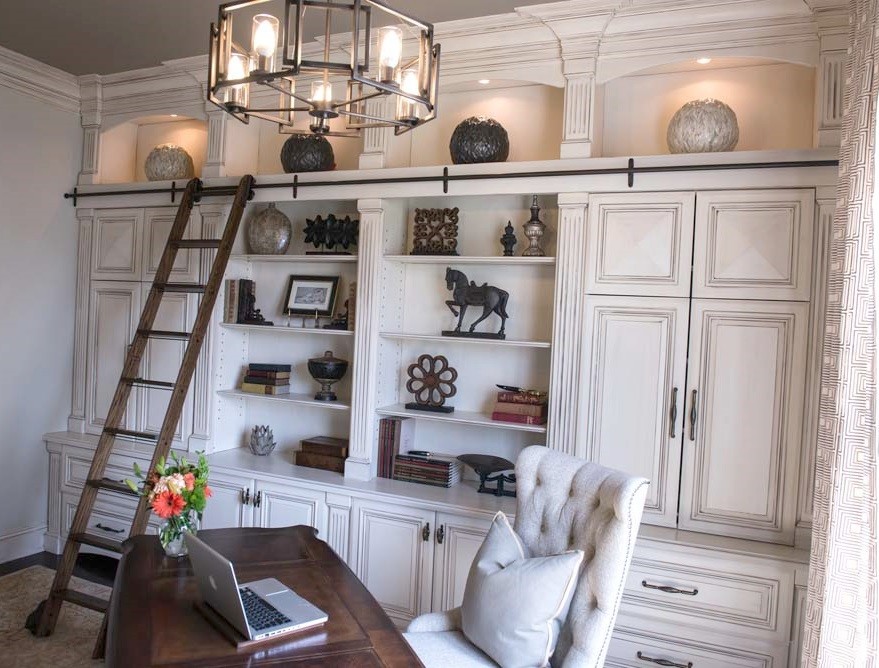 Inspiration for a medium sized classic home office in DC Metro with grey walls, medium hardwood flooring, no fireplace, a freestanding desk and brown floors.