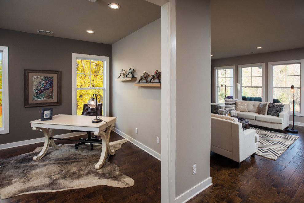 Example of a mid-sized arts and crafts home office design in Louisville