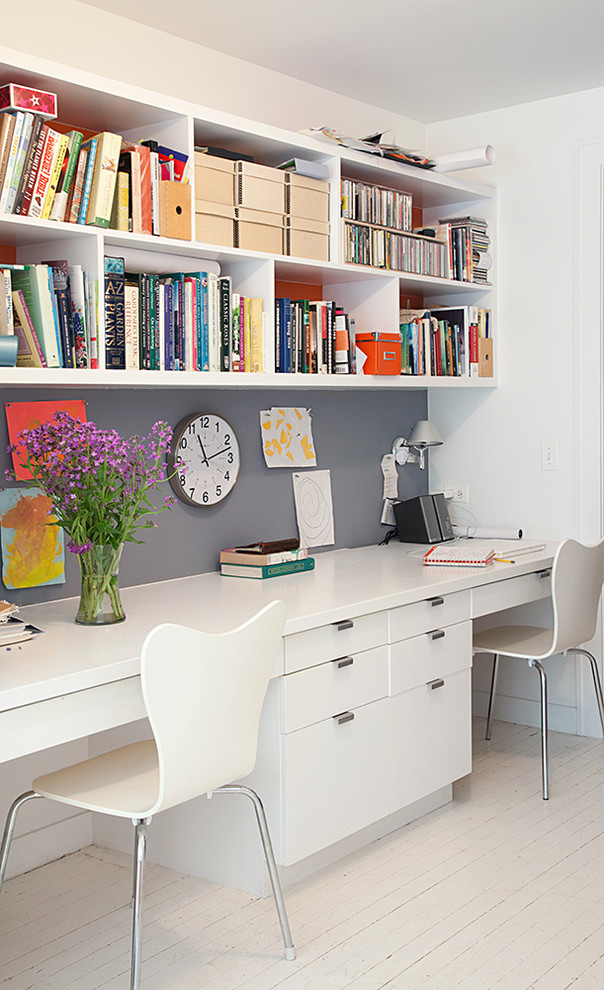 Design ideas for a modern home office in New York with a built-in desk.