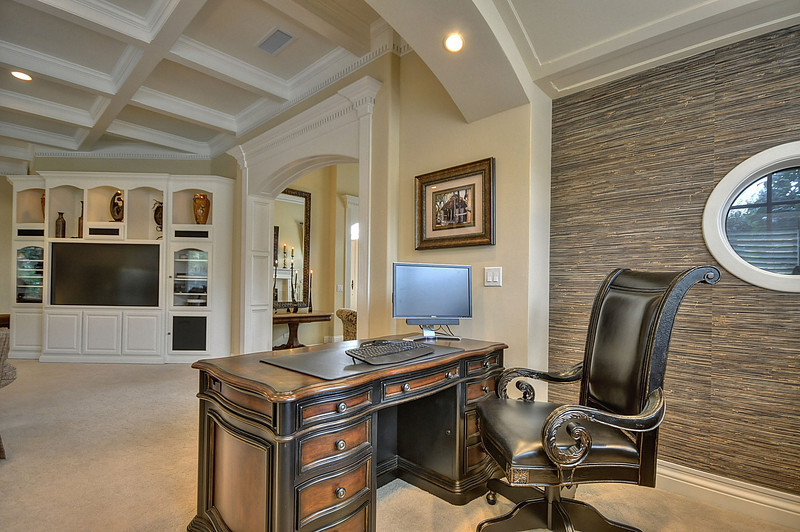 Inspiration for a huge timeless freestanding desk carpeted study room remodel in Sacramento with beige walls and no fireplace