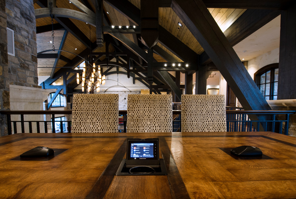 Large mountain style freestanding desk medium tone wood floor study room photo in Denver