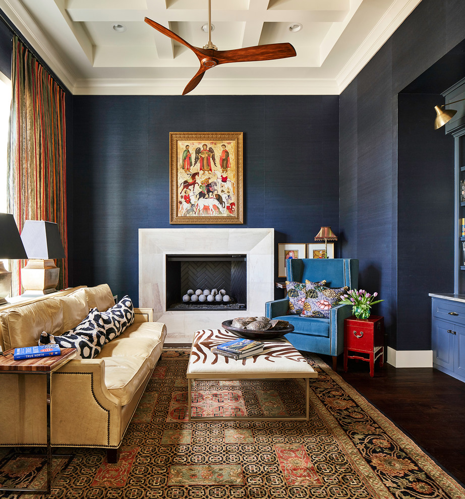 Design ideas for a large classic study in Austin with blue walls, dark hardwood flooring, a standard fireplace, a stone fireplace surround and a built-in desk.