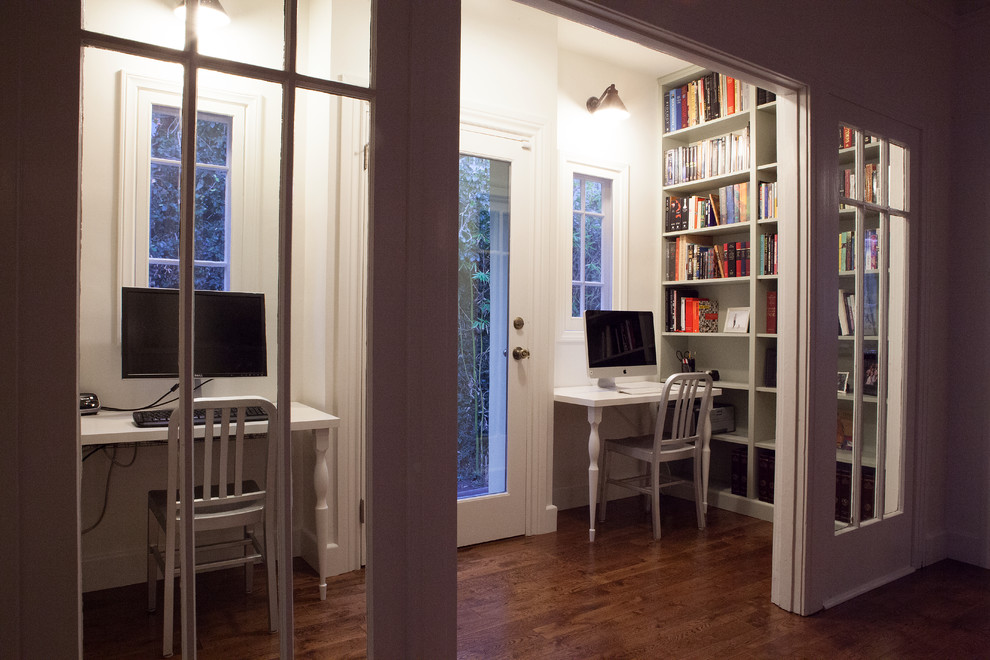 This is an example of a medium sized contemporary study in San Francisco with beige walls, medium hardwood flooring, no fireplace and a built-in desk.