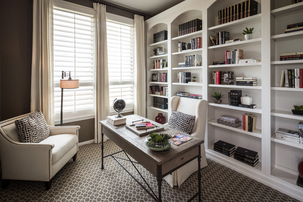 Example of a transitional home office design in Houston