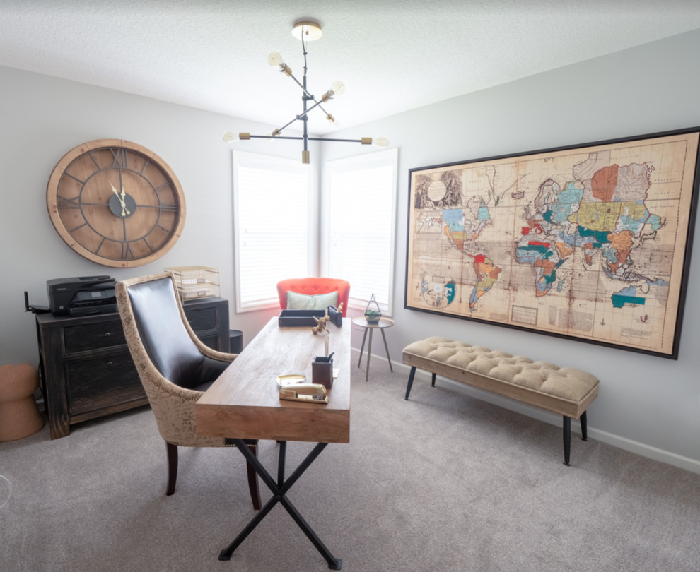 This is an example of a medium sized classic study in Minneapolis with grey walls, carpet, a freestanding desk and grey floors.
