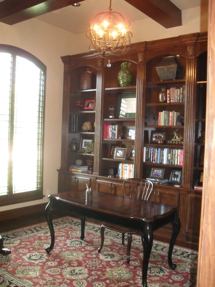 Inspiration for a large classic study in Houston with beige walls, medium hardwood flooring and a freestanding desk.