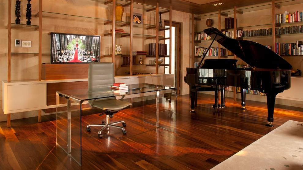 Large minimalist freestanding desk dark wood floor home office photo in Houston with beige walls and no fireplace