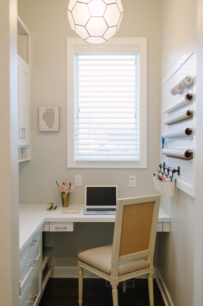 Small classic craft room in Detroit with dark hardwood flooring, no fireplace and a built-in desk.