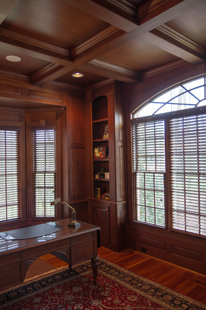 Medium sized traditional home office in Raleigh with medium hardwood flooring, no fireplace, a freestanding desk, a reading nook and brown walls.