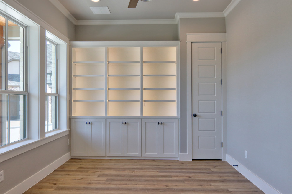 Study room - mid-sized transitional freestanding desk vinyl floor and brown floor study room idea in Dallas with gray walls and no fireplace