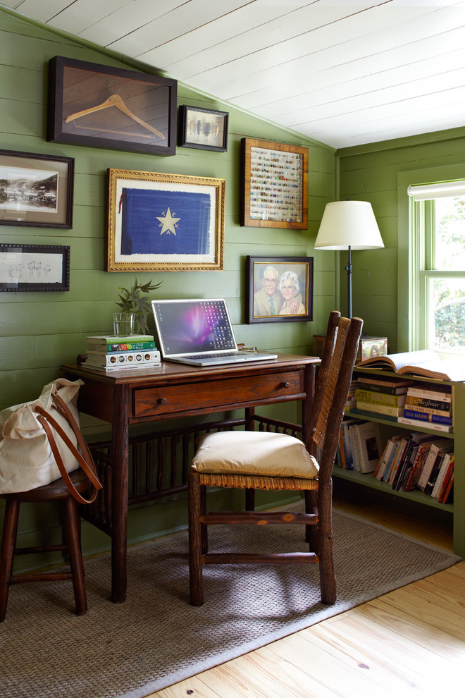 Inspiration for a country freestanding desk light wood floor home office remodel in Austin with green walls