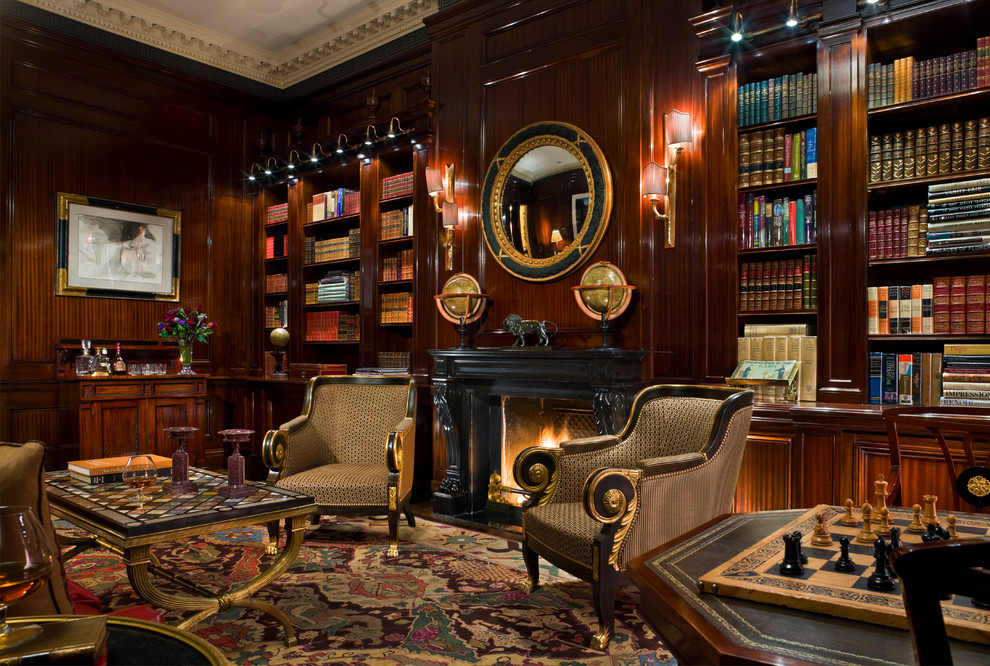 Photo of an expansive classic study in New York with brown walls, carpet and a standard fireplace.