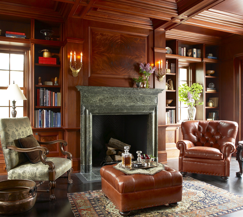 ボストンにあるラグジュアリーな巨大なトラディショナルスタイルのおしゃれなホームオフィス・書斎 (濃色無垢フローリング、茶色い壁、標準型暖炉、石材の暖炉まわり、茶色い床) の写真