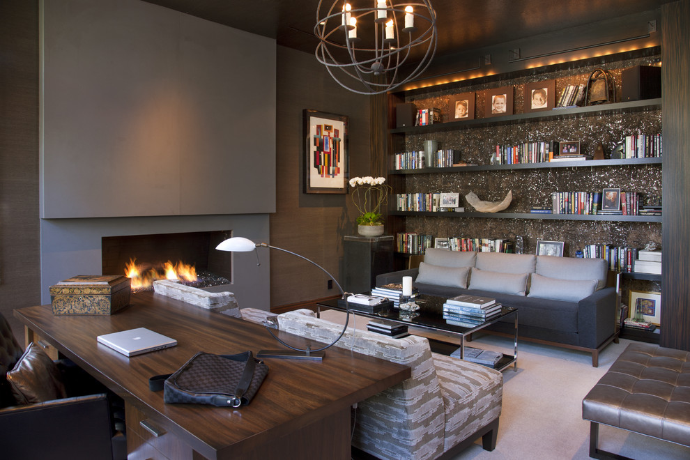 Example of a trendy freestanding desk carpeted home office design in San Diego with a ribbon fireplace