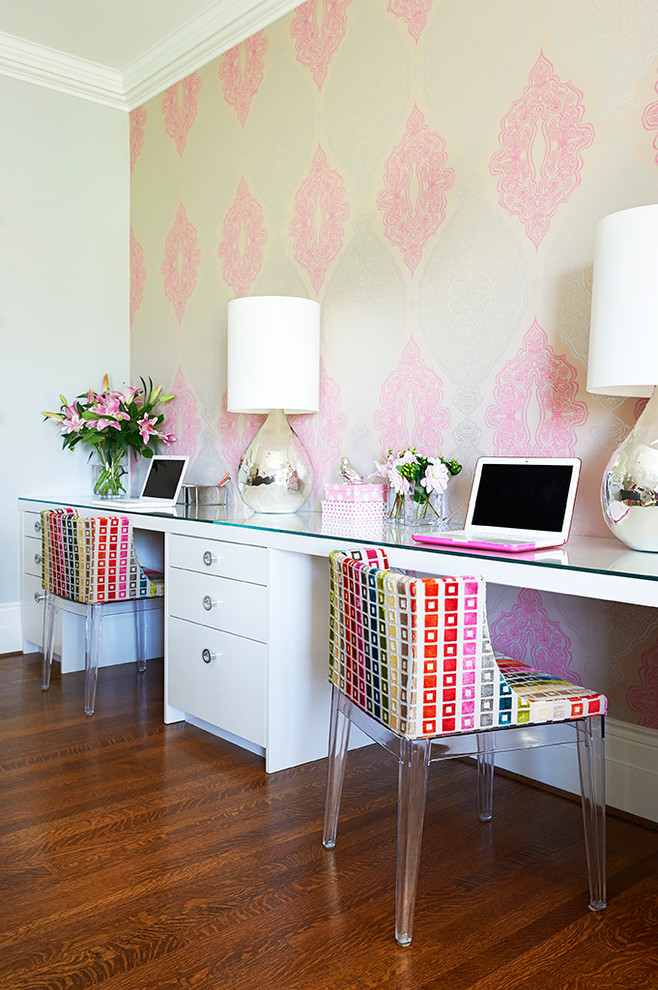 Example of a transitional built-in desk dark wood floor study room design in Toronto with multicolored walls