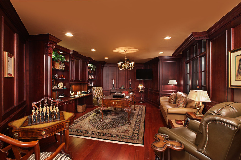 Large elegant dark wood floor study room photo in Detroit with brown walls