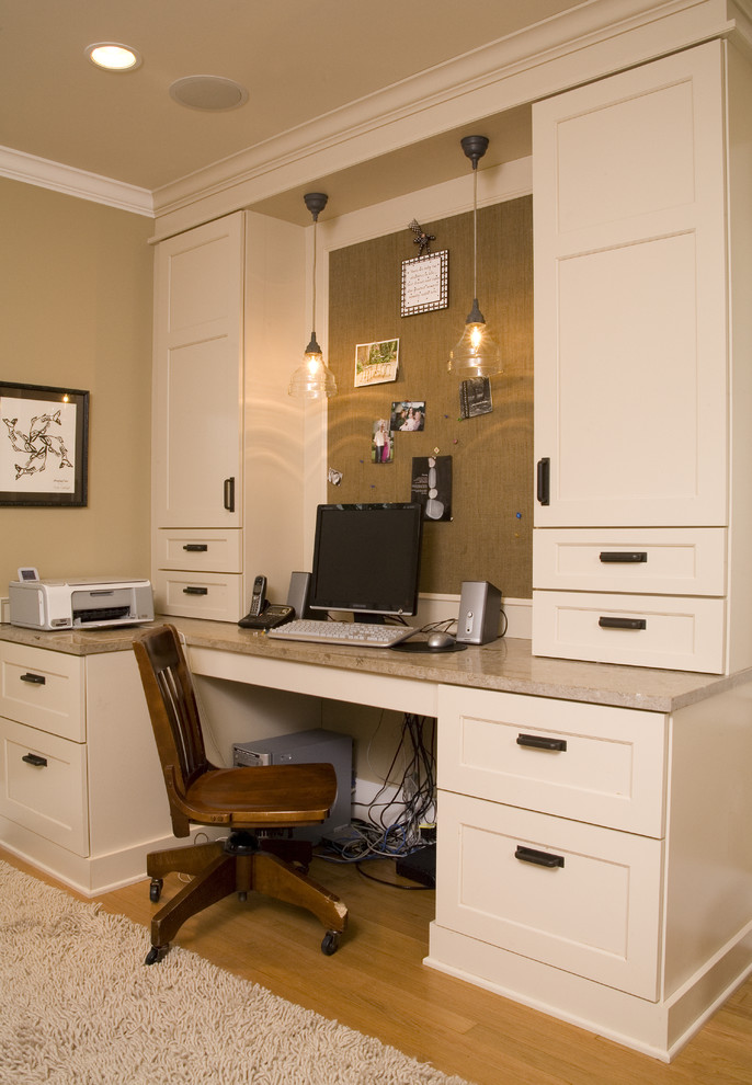Home office - traditional built-in desk home office idea in Seattle