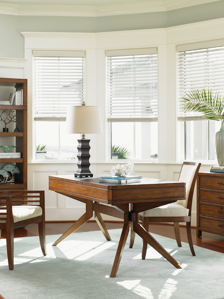 Inspiration for a transitional freestanding desk medium tone wood floor study room remodel in Salt Lake City with gray walls