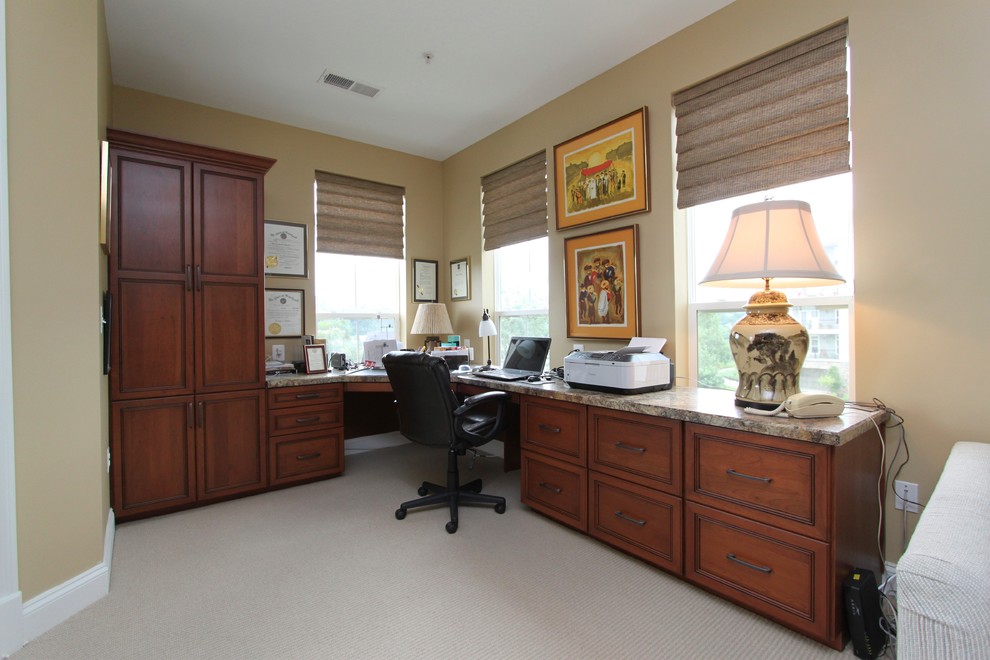 Large transitional built-in desk carpeted study room photo in Baltimore with beige walls and no fireplace