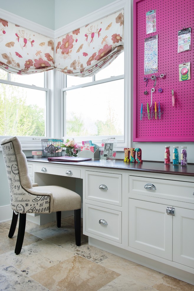 Small elegant built-in desk limestone floor craft room photo in Kansas City with gray walls and no fireplace