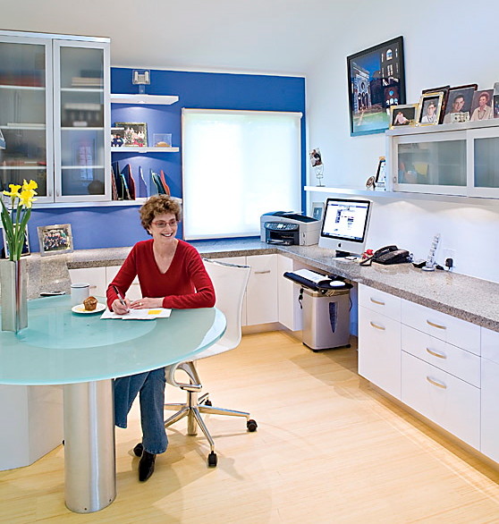 Inspiration for a mid-sized contemporary built-in desk bamboo floor study room remodel in San Diego with blue walls